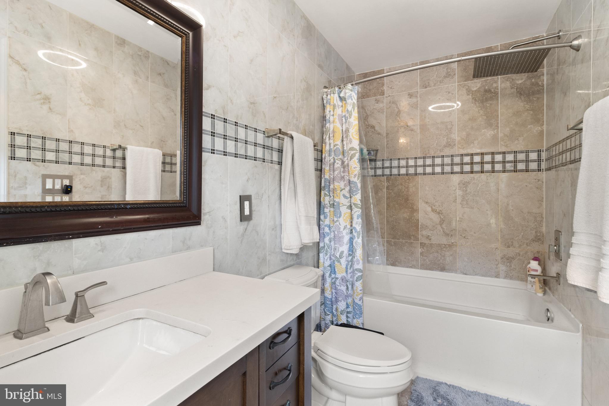244 Raintree Boulevard Stafford, VA 22556 - Photo 16 of 34 a bathroom with a sink toilet and shower