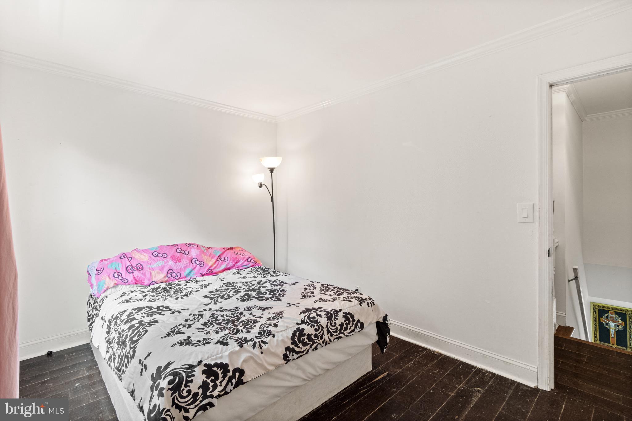 244 Raintree Boulevard Stafford, VA 22556 - Photo 19 of 34 a bedroom with a bed and a wooden floor