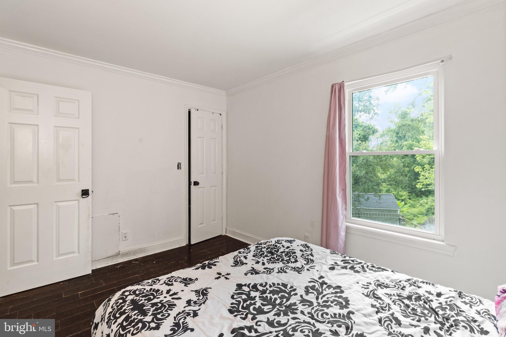 244 Raintree Boulevard Stafford, VA 22556 - Photo 20 of 34 a bedroom with a bed and a window