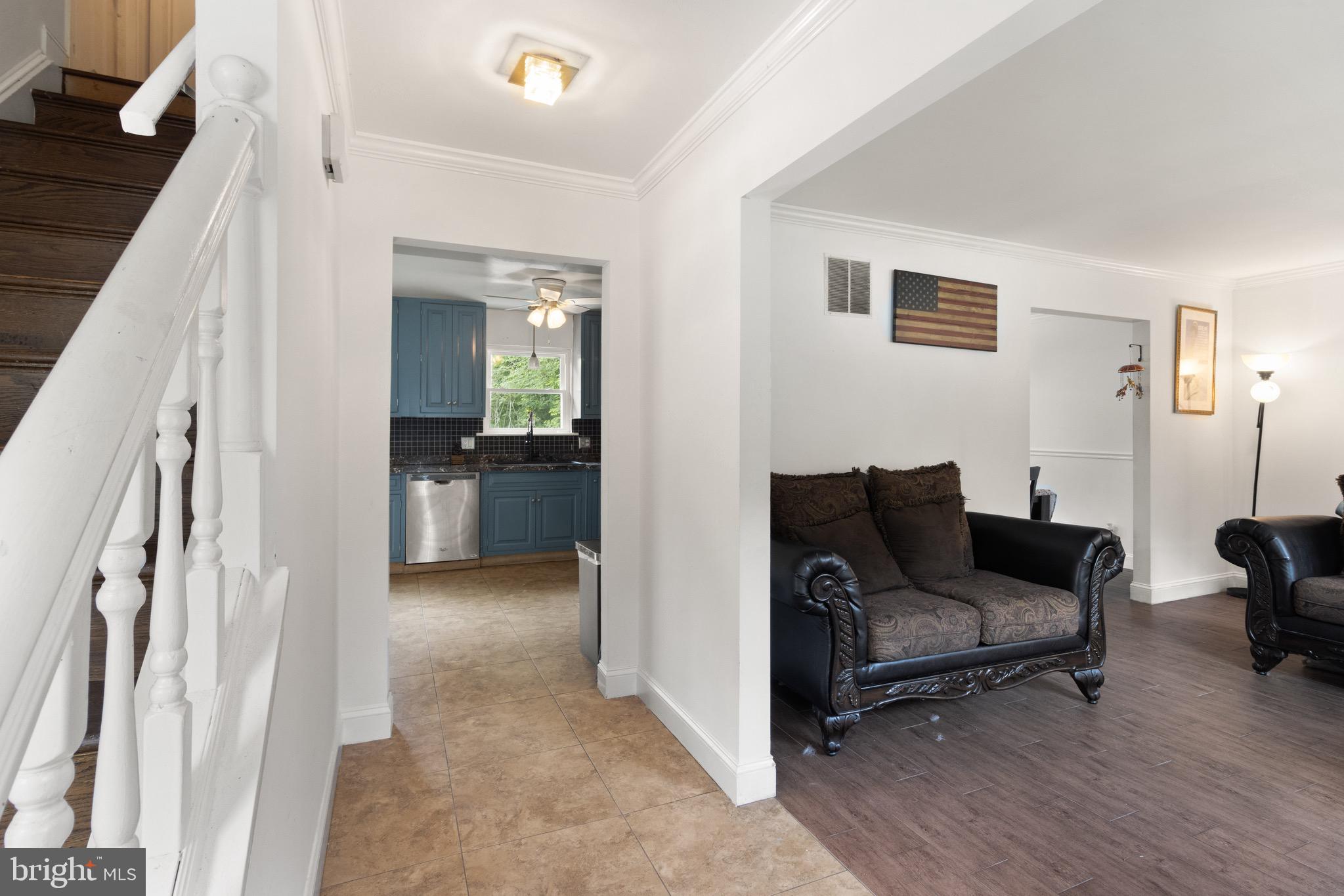 244 Raintree Boulevard Stafford, VA 22556 - Photo 3 of 34 a living room with furniture and a wooden floor