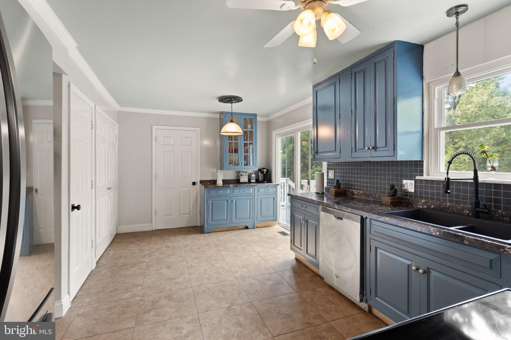 244 Raintree Boulevard Stafford, VA 22556 - Photo 8 of 34 a kitchen with stainless steel appliances granite countertop a sink cabinets and window