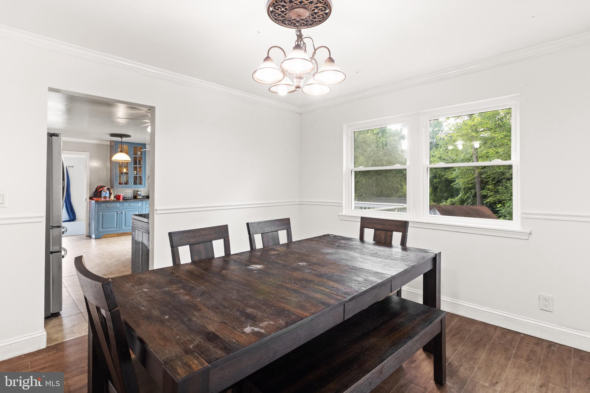 244 Raintree Boulevard Stafford, VA 22556 - Photo 10 of 34 a view of a dining room with furniture and wooden floor