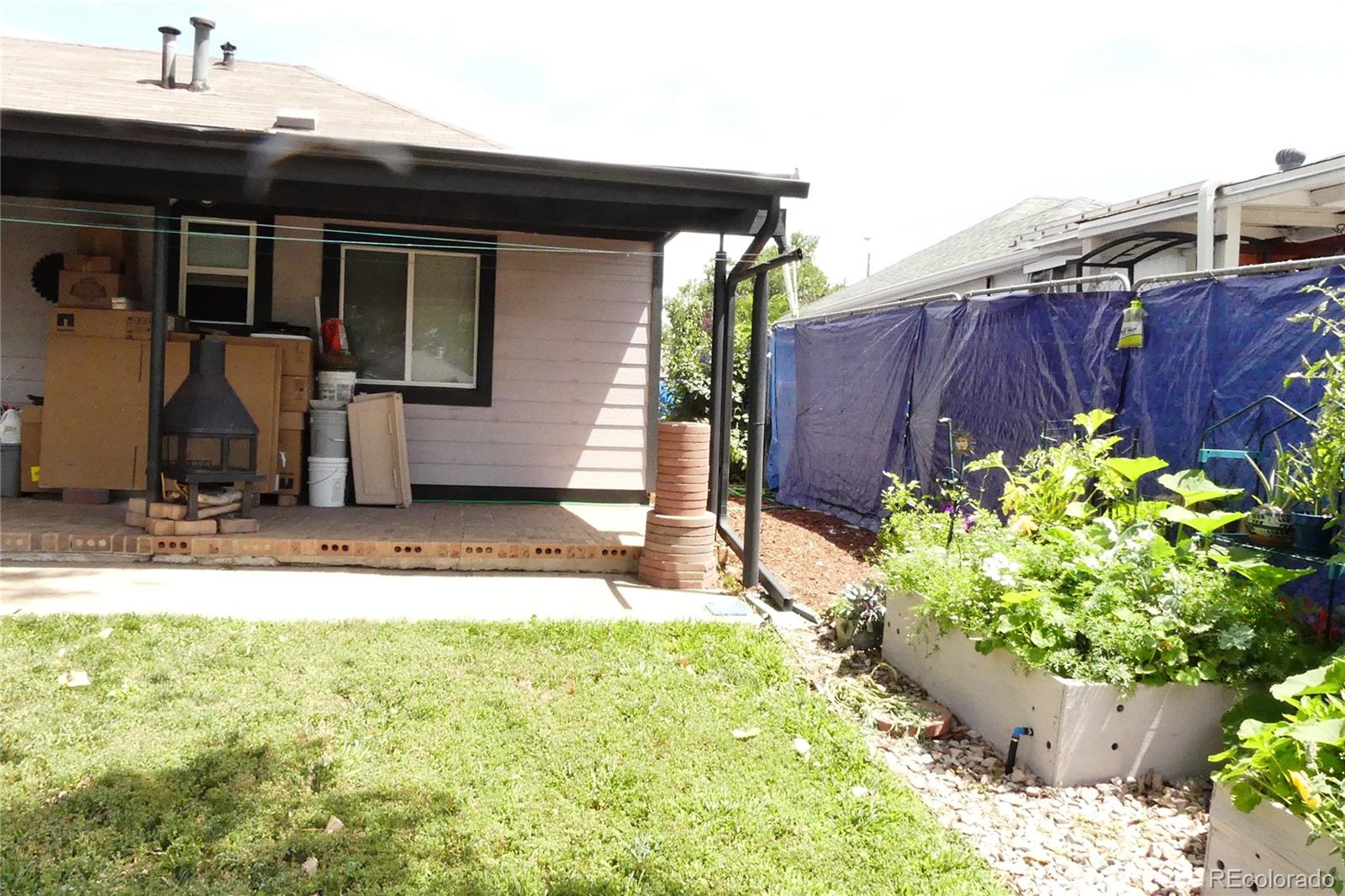 4851 Adams Street Denver, CO 80216 - Photo 21 of 30 a view of a backyard