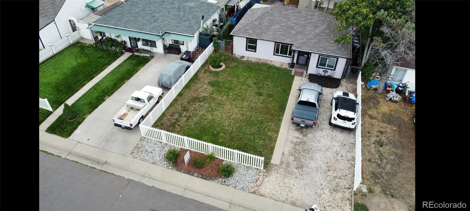 4851 Adams Street Denver, CO 80216 - Photo 5 of 30 aerial view of a house with a yard