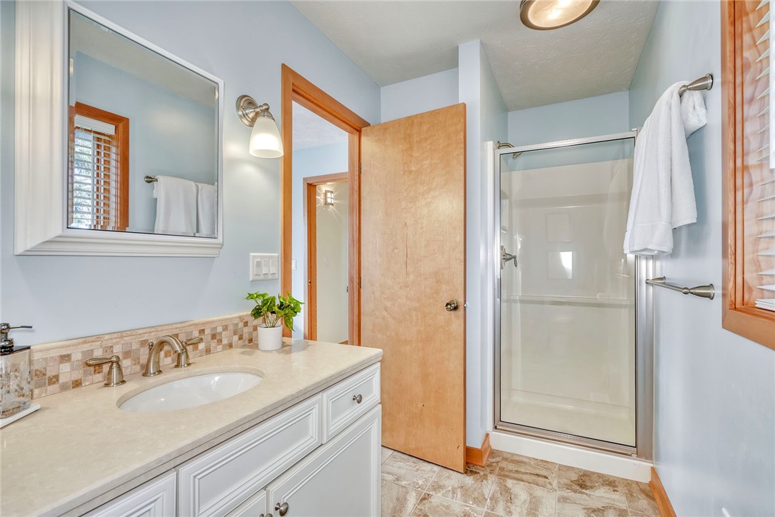 2609 Lake Road Ontario, NY 14519 - Photo 37 of 50 1st Floor Primary Bedroom Ensuite with Linen stora