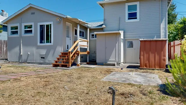 a view of a house with wooden stairs