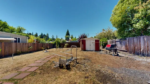 a view of a backyard with furniture
