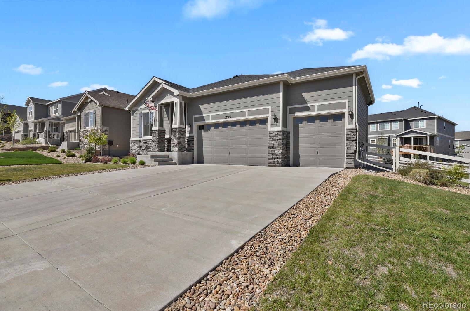 5723 Berry Ridge Wy. Castle Rock, CO 80104 - Photo 2 of 48 a front view of a house with a yard