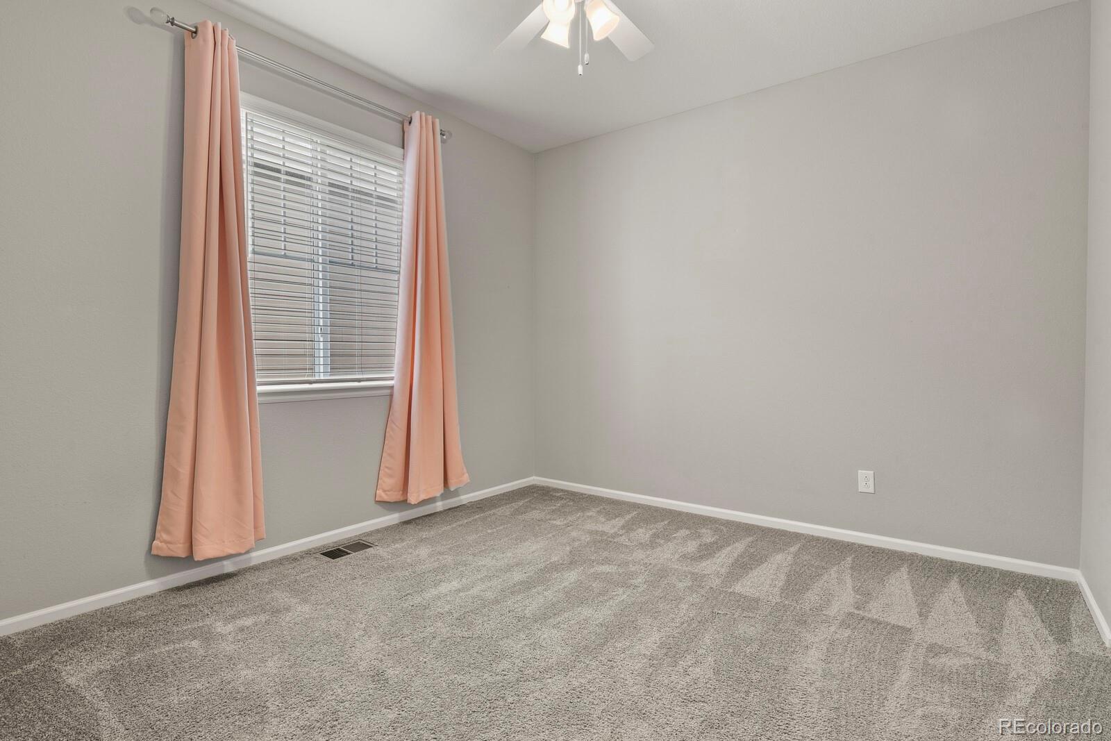 5723 Berry Ridge Wy. Castle Rock, CO 80104 - Photo 29 of 48 a view of an empty room with a window