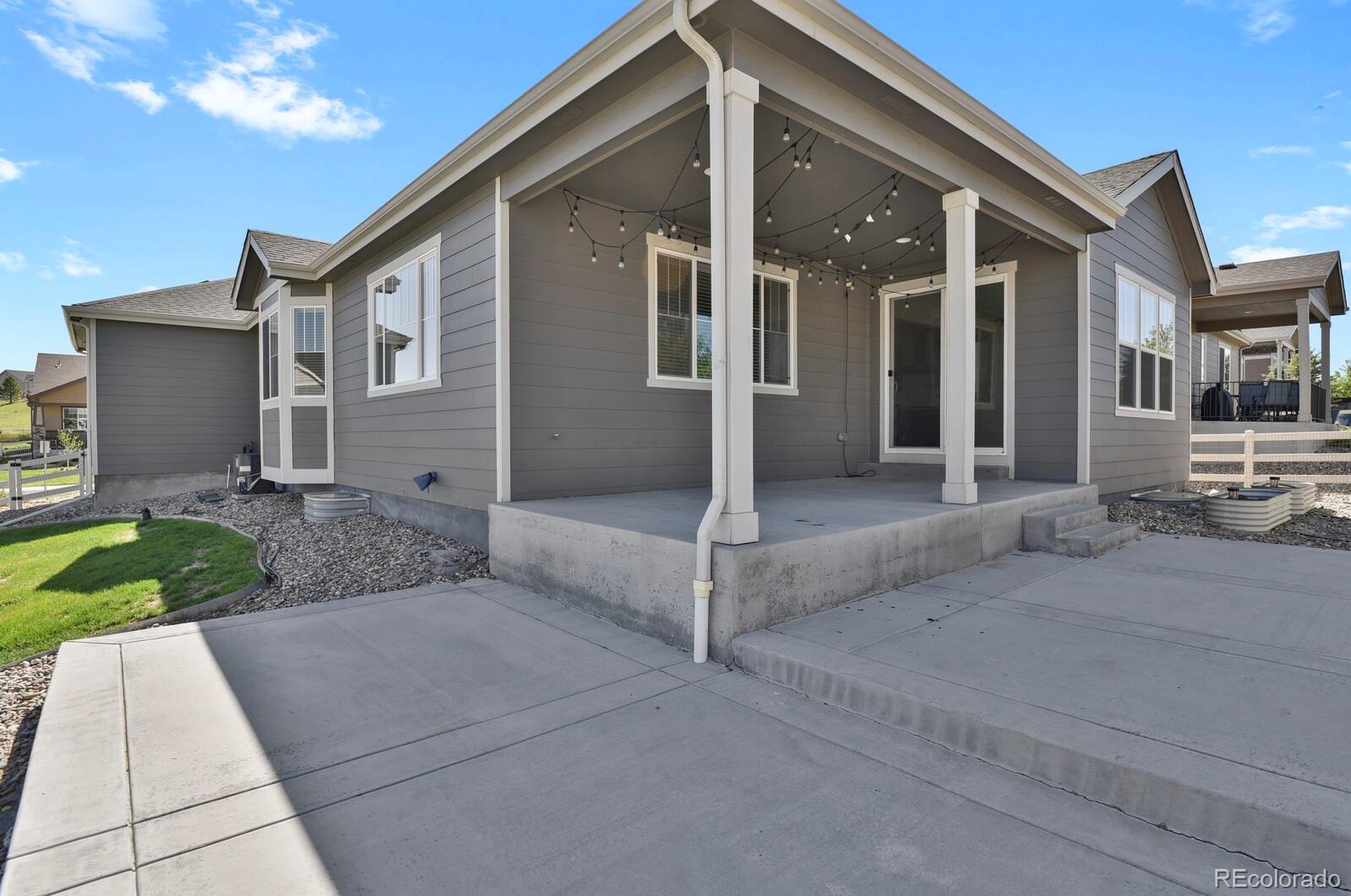 5723 Berry Ridge Wy. Castle Rock, CO 80104 - Photo 43 of 48 a view of a house with a yard