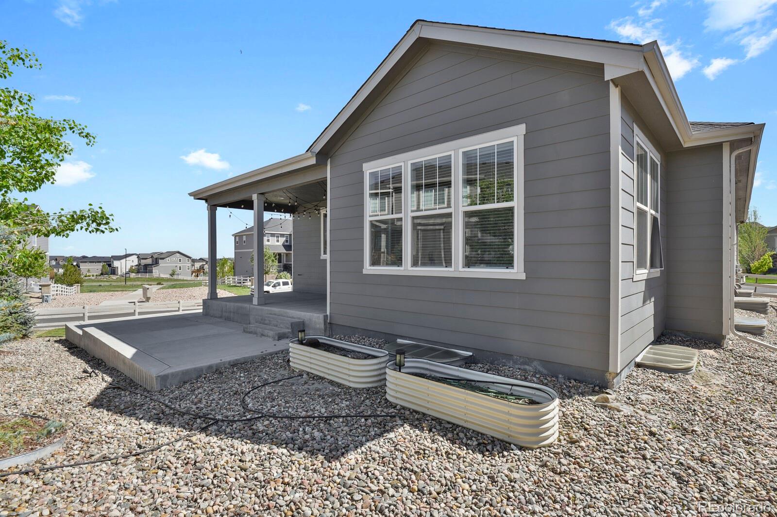 5723 Berry Ridge Wy. Castle Rock, CO 80104 - Photo 48 of 48 a front view of a house with garden