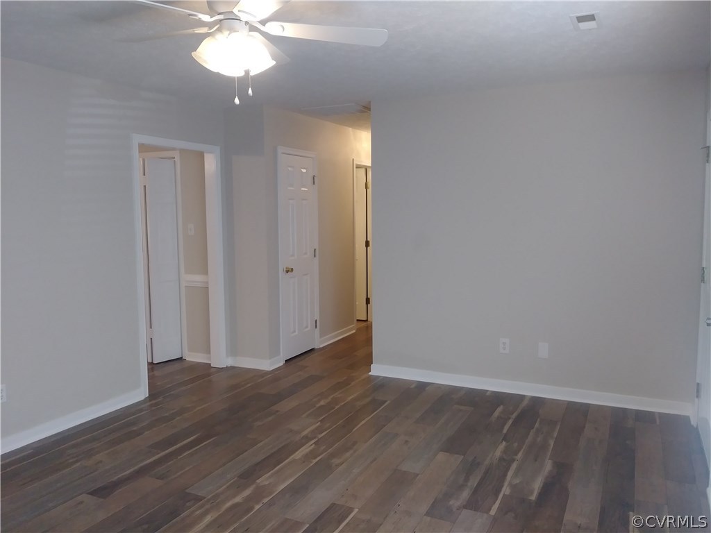 8320 Fredericks Hall Road Mineral, VA 23117 - Photo 8 of 39 an empty room with wooden floor and chandelier fan