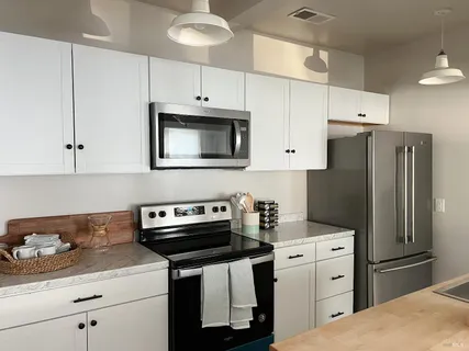 a living room with furniture and a rug