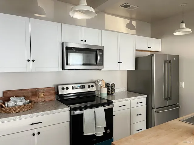 a living room with furniture and a rug