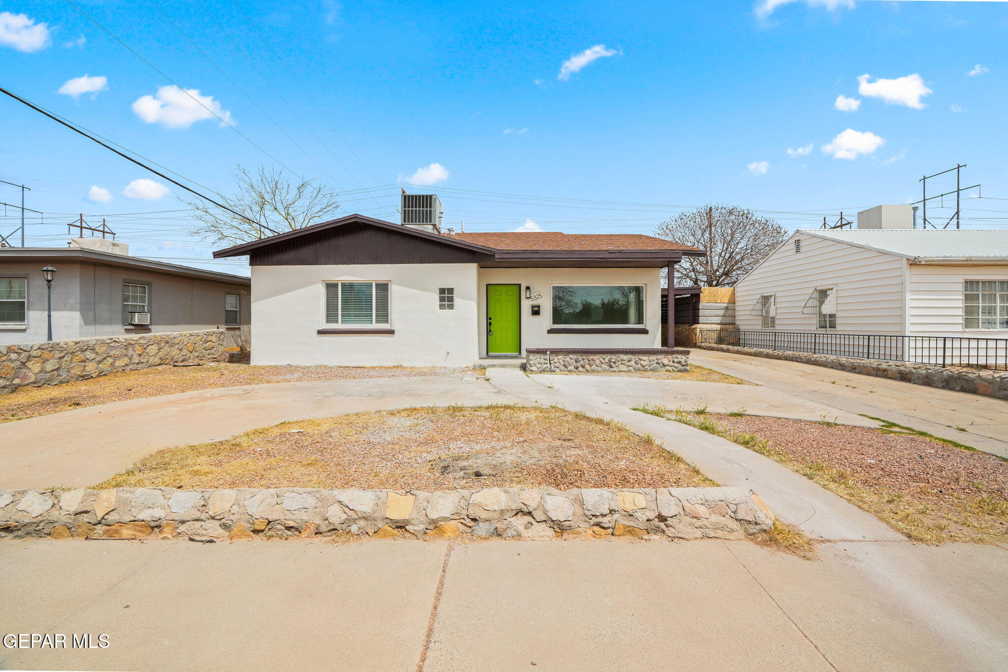 a front view of a house with a patio