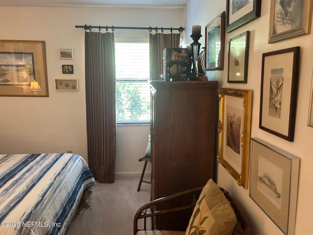 a bed room with a bed and a window