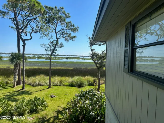 a view of a back yard of the house