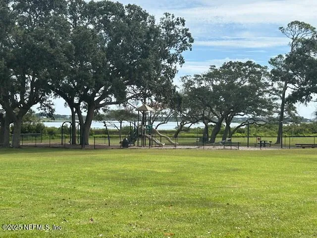a backyard of apartments with lots of trees