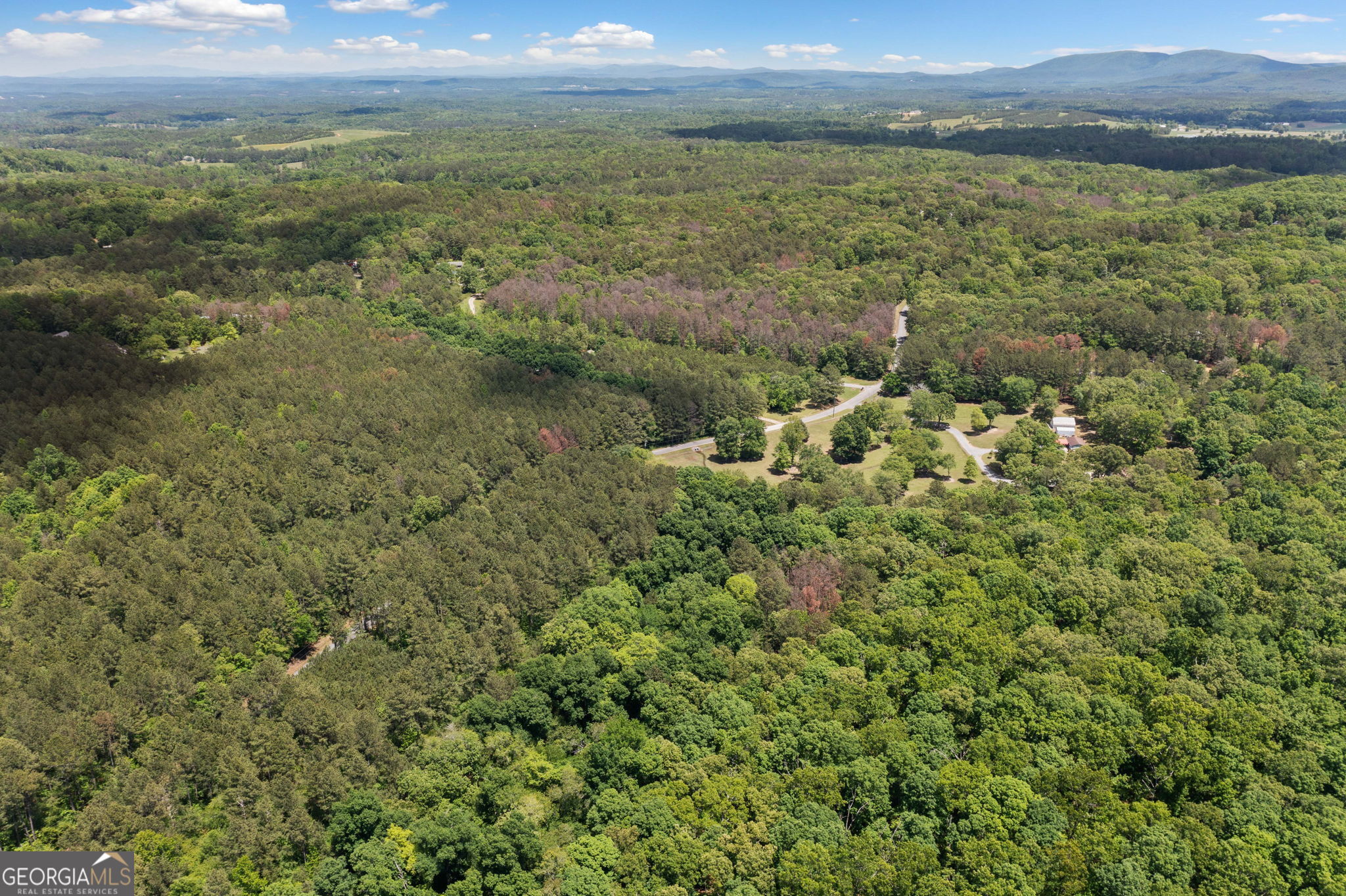 0 Timberwood Road Northwest, Unit 6 White, GA 30184 - Photo 9 of 26 a view of a lake with mountains in the background