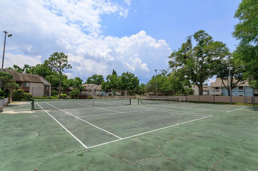 240 Orienta Point Street, Unit 240 Altamonte Springs, FL 32701 - Photo 20 of 20 a view of an outdoor space and tennis court