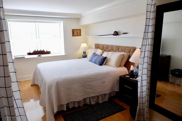 a bed room with a bed and a window