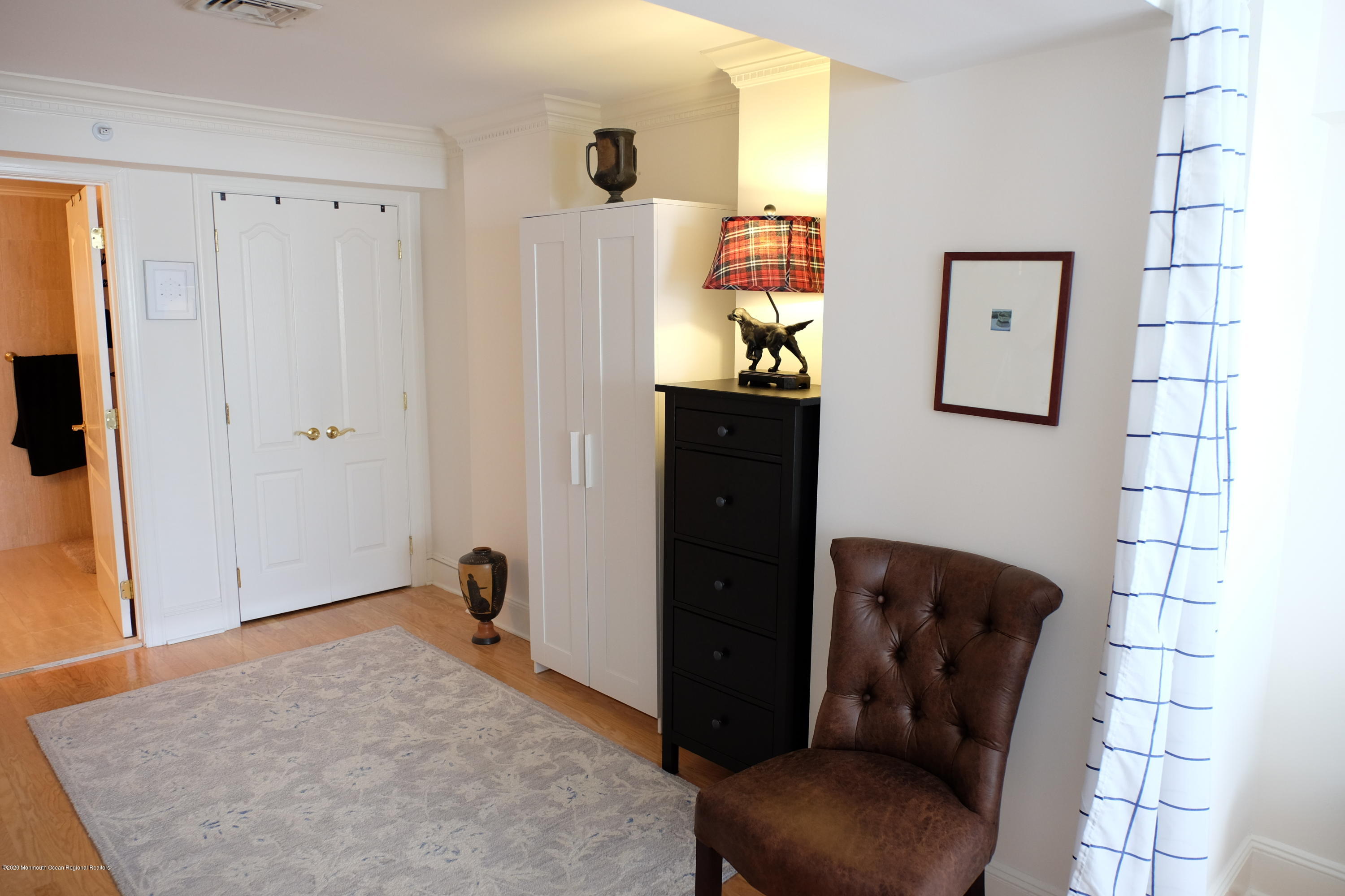 700 Ocean Avenue, Unit G1 Spring Lake, NJ 07762 - Photo 15 of 42 a bedroom with a bed and furniture