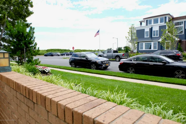 a view of street with houses and a yard