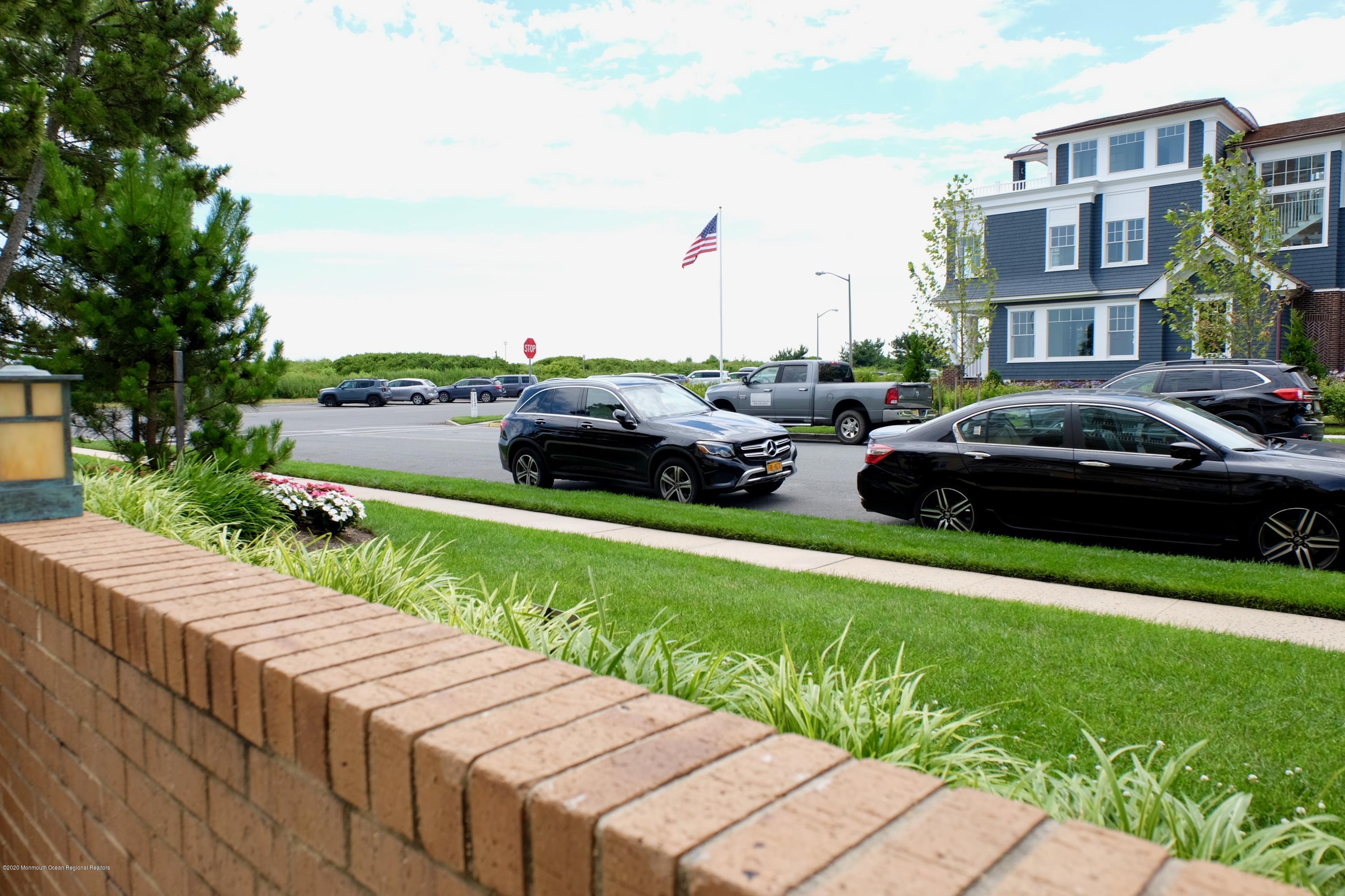 700 Ocean Avenue, Unit G1 Spring Lake, NJ 07762 - Photo 20 of 42 a view of street with houses and a yard