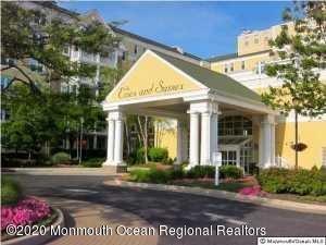 700 Ocean Avenue, Unit G1 Spring Lake, NJ 07762 - Photo 2 of 42 a view of a white house with a large windows