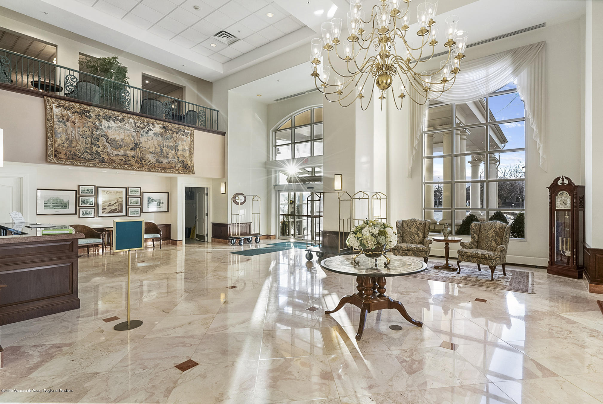 700 Ocean Avenue, Unit G1 Spring Lake, NJ 07762 - Photo 22 of 42 a living room with fireplace furniture and a chandelier