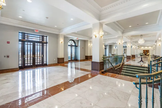 a lobby with furniture and floor