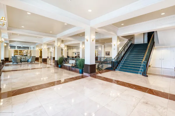 a view of a hallway with seating area