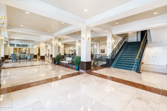 a view of a hallway with seating area