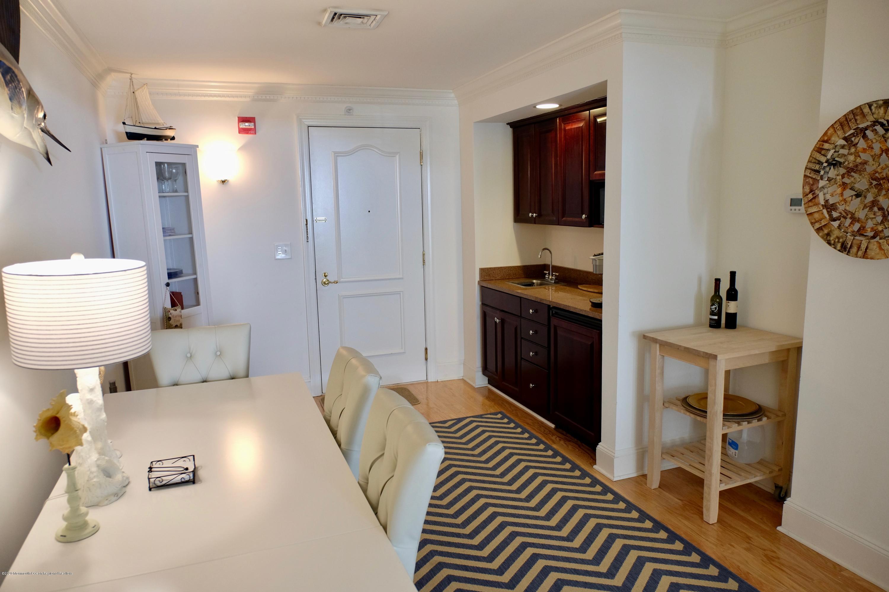 700 Ocean Avenue, Unit G1 Spring Lake, NJ 07762 - Photo 7 of 42 a bedroom with a bed and a couch