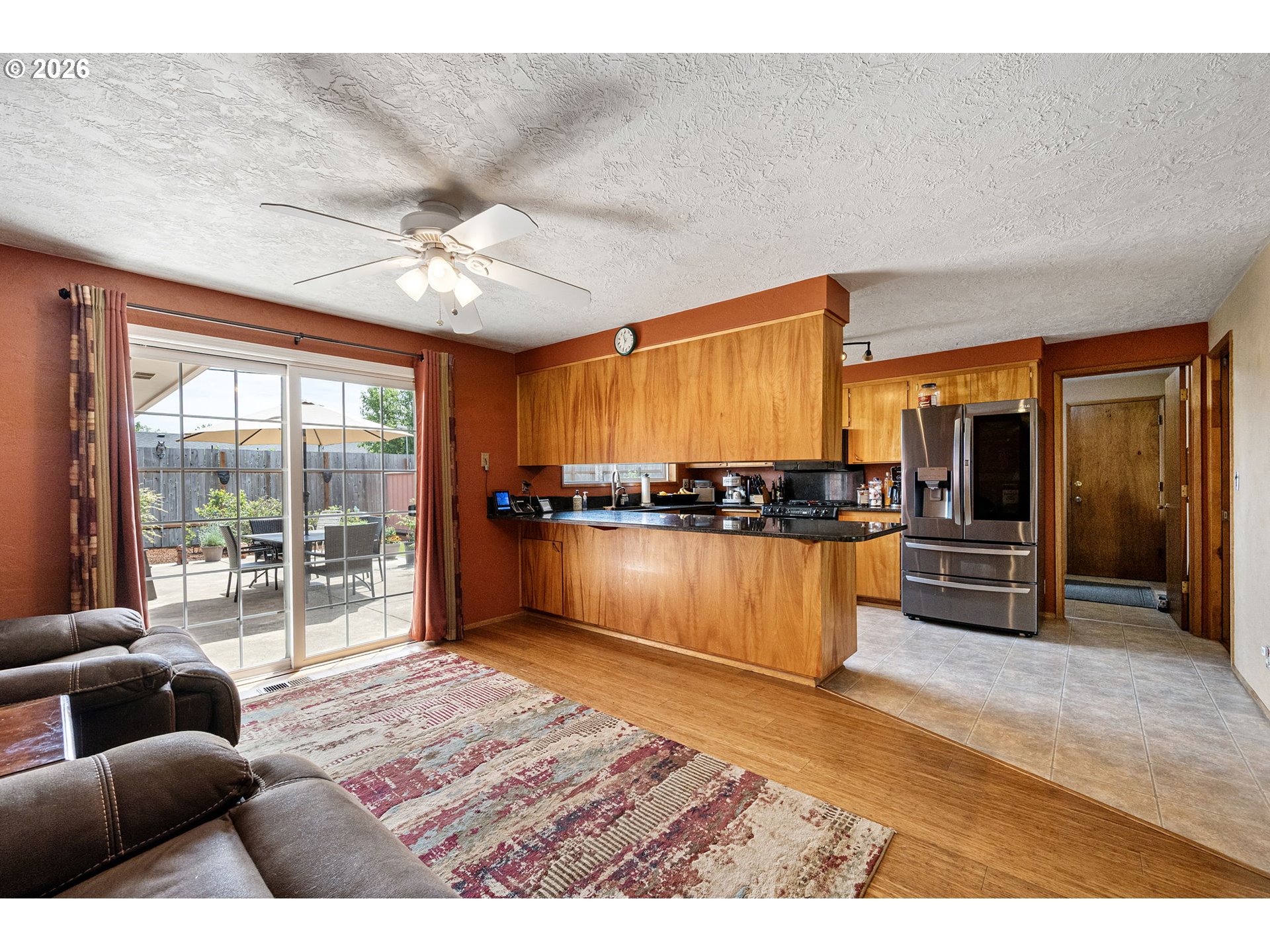 2465 17th Street Springfield, OR 97477 - Photo 12 of 47 a living room with furniture and a kitchen