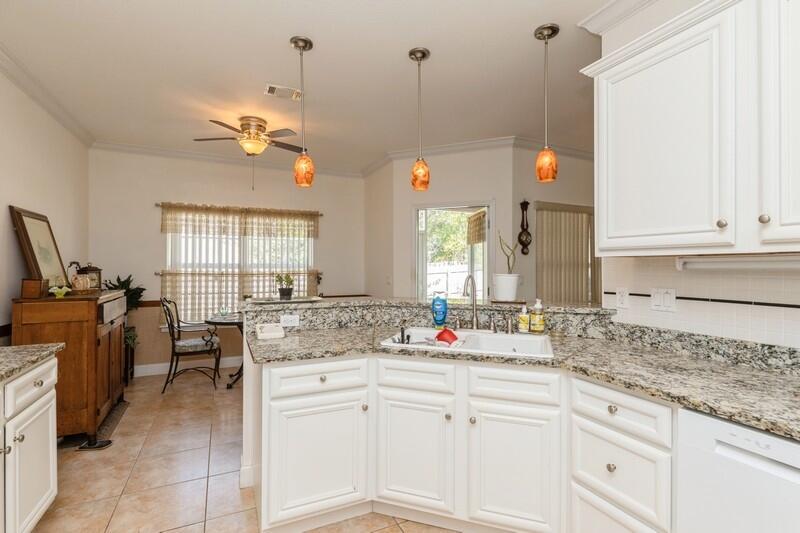 4647 Hermosa Road Crestview, FL 32539 - Photo 12 of 33 a kitchen with cabinets appliances and a window