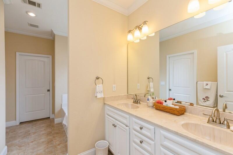 4647 Hermosa Road Crestview, FL 32539 - Photo 18 of 33 a bathroom with double vanity and a mirror