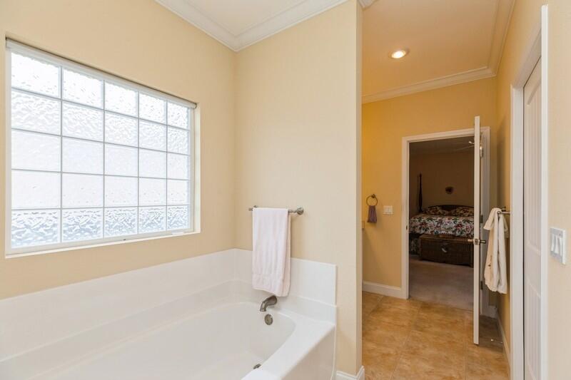 4647 Hermosa Road Crestview, FL 32539 - Photo 19 of 33 a bathroom with a tub and shower