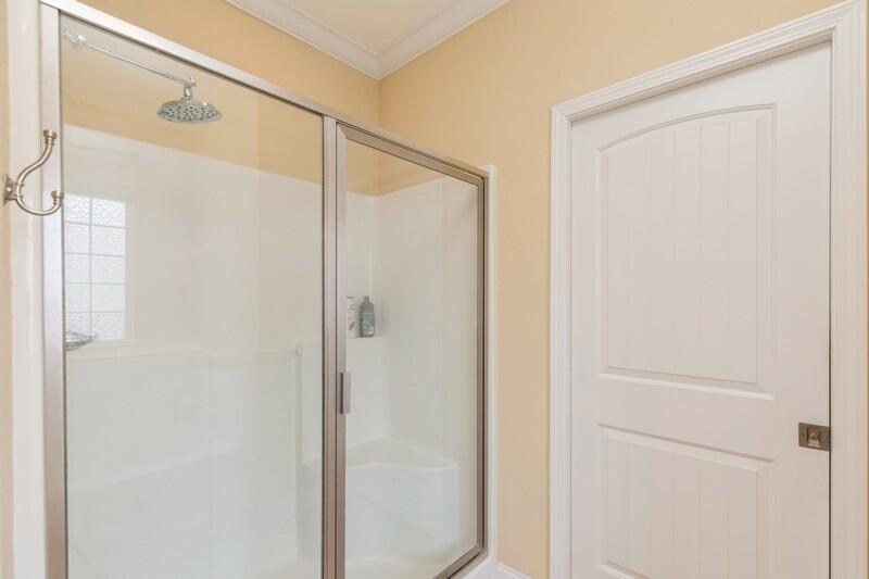 4647 Hermosa Road Crestview, FL 32539 - Photo 20 of 33 a bathroom with a glass shower door