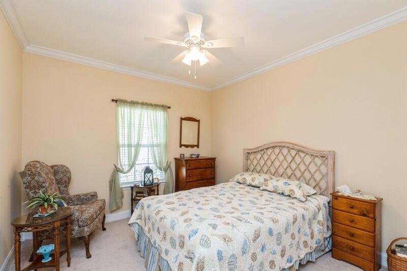 4647 Hermosa Road Crestview, FL 32539 - Photo 21 of 33 a bedroom with a bed and furniture
