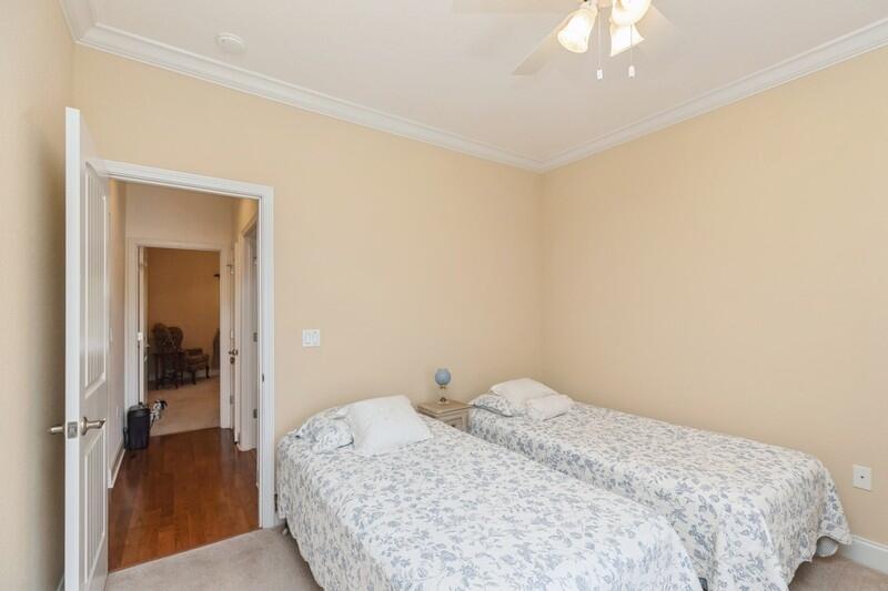 4647 Hermosa Road Crestview, FL 32539 - Photo 26 of 33 a bedroom with a bed and a chandelier