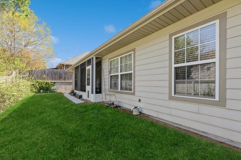 4647 Hermosa Road Crestview, FL 32539 - Photo 29 of 33 a view of house with backyard space and garden