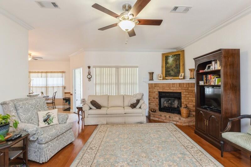 4647 Hermosa Road Crestview, FL 32539 - Photo 6 of 33 a living room with furniture a fireplace and a flat screen tv
