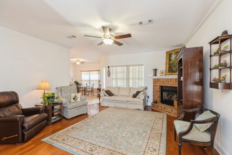 4647 Hermosa Road Crestview, FL 32539 - Photo 7 of 33 a living room with furniture fireplace and flat screen tv
