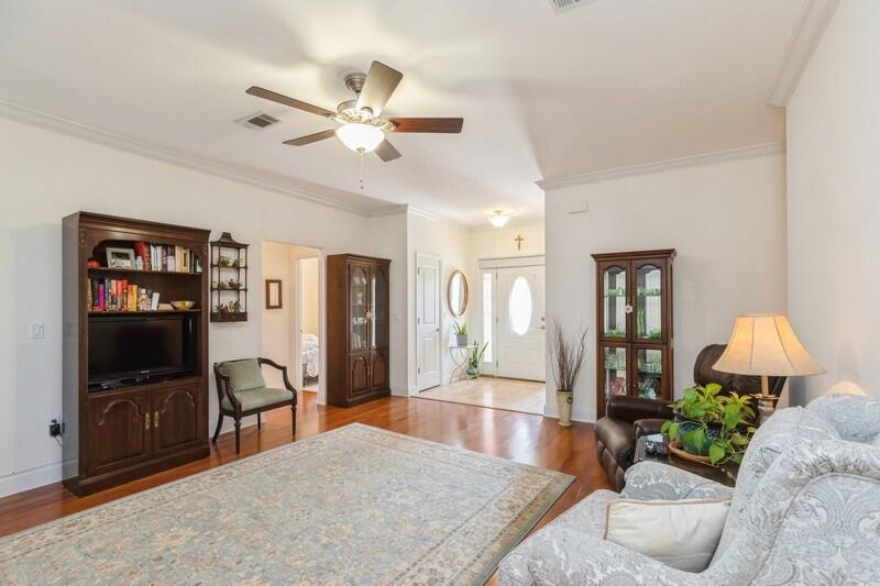 4647 Hermosa Road Crestview, FL 32539 - Photo 8 of 33 a living room with furniture and a flat screen tv