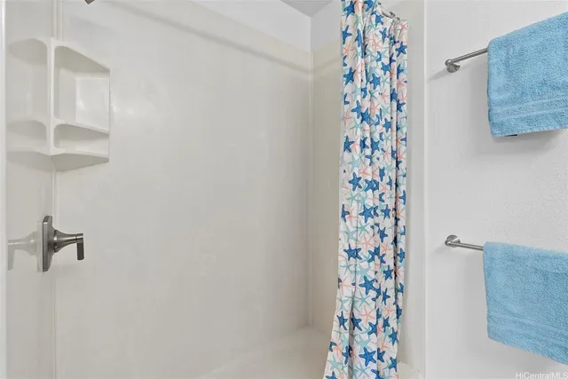 a bathroom with a shower curtain