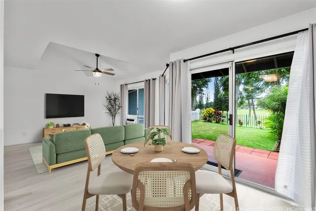 a view of a livingroom with furniture window and wooden floor