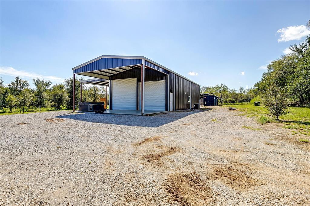 901 Remington Road Santo, TX 76472 - Photo 11 of 40 a view of a house with a yard