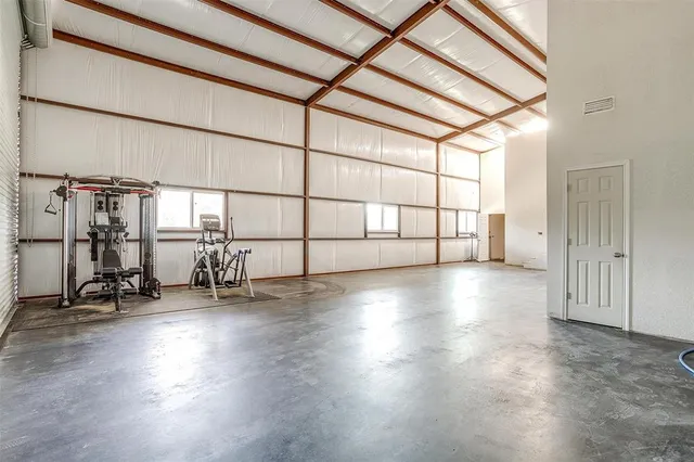 a view of a livingroom with wooden floor and a window