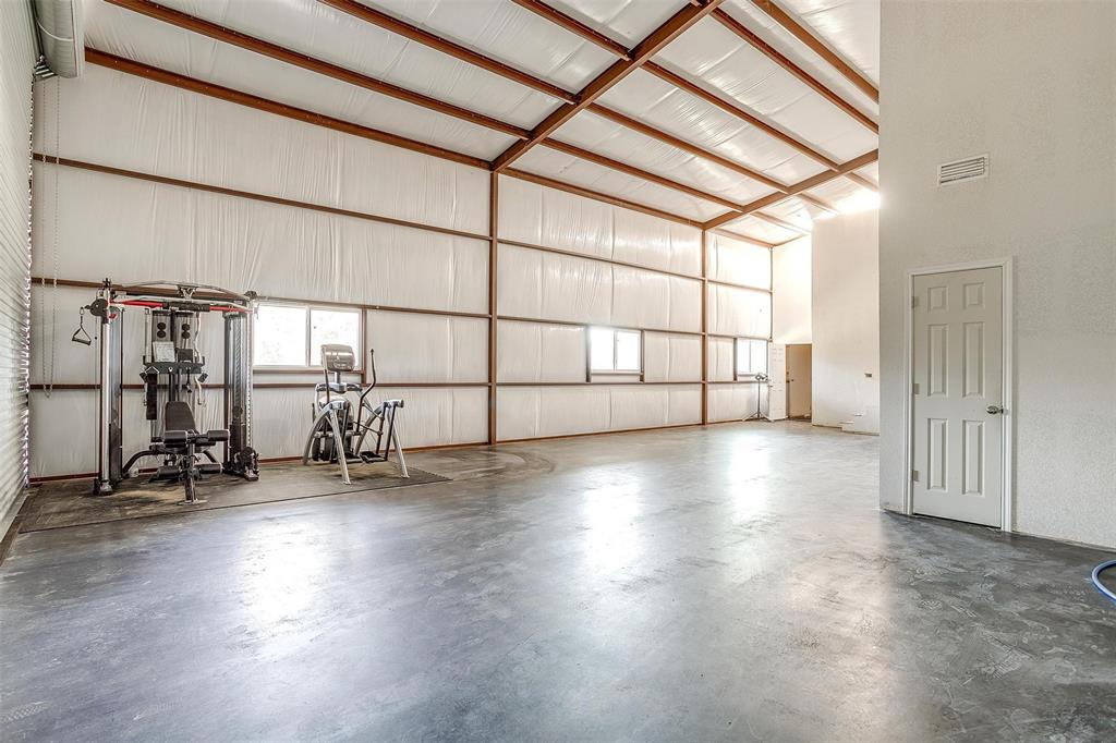 901 Remington Road Santo, TX 76472 - Photo 12 of 40 a view of a livingroom with wooden floor and a window